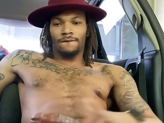 Sexy black guy jerks off in his car and shoots a nice load