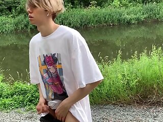 Jerking off and cumming next to lake in the forest