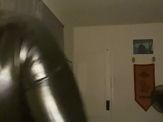 Puppy in rubber getting set up for bed time. Wearingrubber and puppy mask.