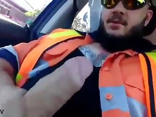 Hot bearded worker playing with is big uncut dick in the car