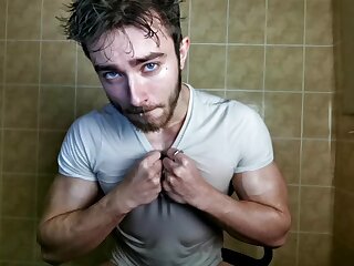 Muscle man rips through his wet shirt to expose his muscles