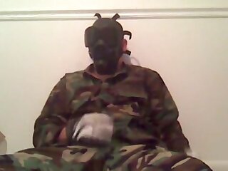 Gasmasked man wanking and beating off