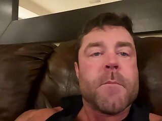 He jerks off and shoots his cum load all over shot glass