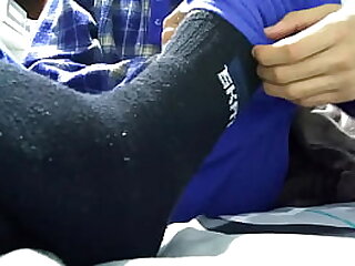 Playing with my black socks and barefeet before rest