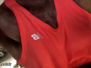 Hairy muscular stud gets all sweaty at the gym and shows off his pits and bulge