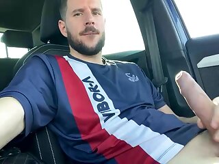 Spanish guy jerks off his uncut cock in his vehicle