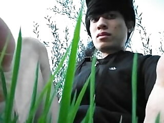 Jon Arteen in short shorts walks on grass barefoot&comma; shows his boy soles&comma; smiles for you