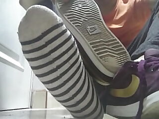 Red sneakers and sweaty socks after a long day