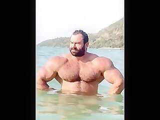 IFBB Pro bodybuilder Mikhail Maslov at the beach
