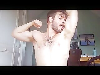 Musky hunk sniffing own pits